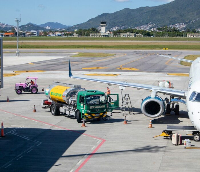 green and yellow truck on airport during daytime
