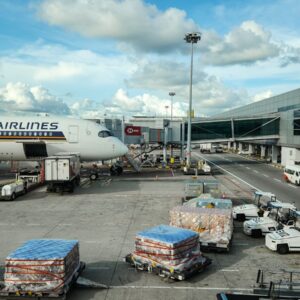 A large jetliner sitting on top of an airport tarmac