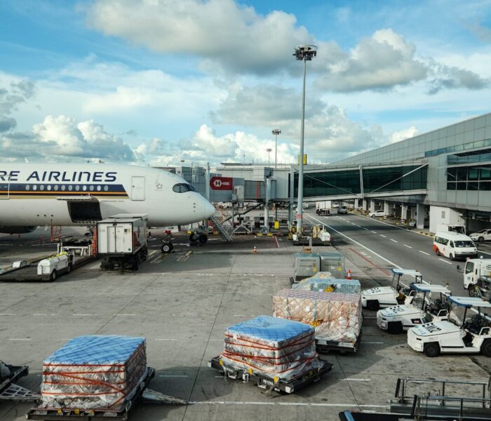 A large jetliner sitting on top of an airport tarmac