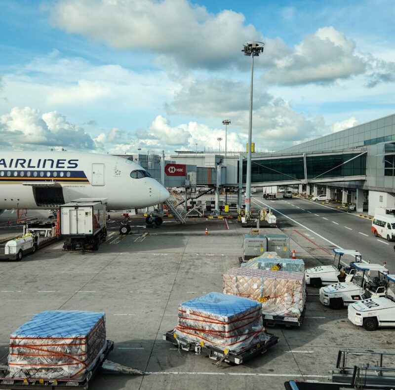 A large jetliner sitting on top of an airport tarmac