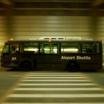red and black bus on gray road