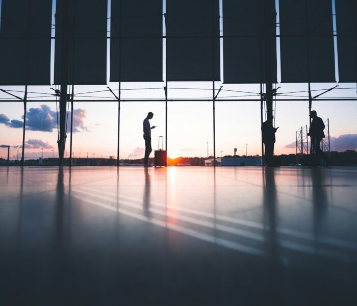 silhouette of person across gray clouds