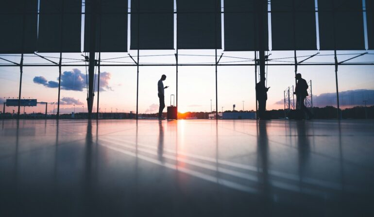 silhouette of person across gray clouds