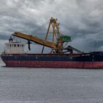 a large ship with cranes on it