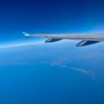 an airplane flying over the ocean
