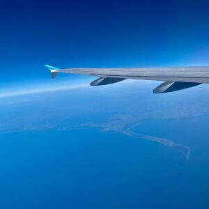 an airplane flying over the ocean