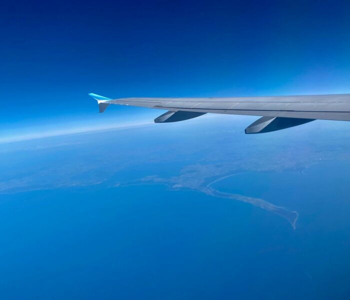 an airplane flying over the ocean